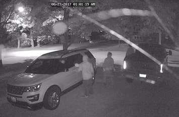Security camera image of three individuals trying to enter vehicles in a private driveway in Mount Forest on August 27th. (photo submitted by OPP) 