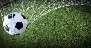 Soccer ball hitting the back of a net. © Can Stock Photo / Suriyaphoto