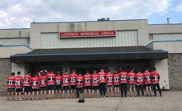 The Listowel Cyclones stand in front of the old Listowel Memorial Arena with their Sutherland Cup Trophy in May 2018. (Photo courtesy of Nancy Anderson)