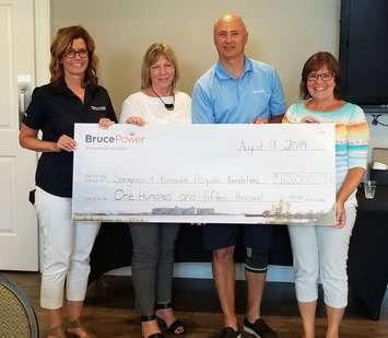 The 18th annual Bruce Power Charity Golf Tournament on August 9 at the Saugeen Golf Club raised $115,000 for two area hospital foundations. Participating in the post-tournament cheque presentation were, from left, Becky Fair, Chair of the Kincardine and Community Health Care Foundation; Peggy Zeppieri, Physician Recruitment Specialist; Mike Rencheck, Bruce Power President and CEO; and Betty-Jo Arnett, Chair of the Saugeen Memorial Hospital Foundation.