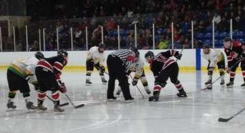 The Walkerton Hawks line up for a face-off in the Schmalz Cup Quarter-Final in Alliston. (Photo by Ryan Brandt)