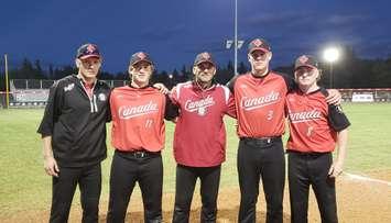 Left to Right: Mac Mulvey, Mac Fischer, Jeff Ellsworth (coach), Logan Tolton, and Owen Torrie of Canada at the 2018 WBSC Jr. Men's Softball World Championships in Prince Albert, SASK. (Photo by Steve Sabourin)