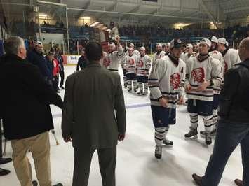 Cullitons captain Tyson Baker brings the Cherry Cup over to his coaching staff. (Photo by Ryan Drury).