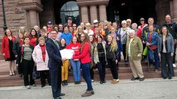 Bruce-Grey-Owen Sound MPP Bill Walker accepts signed petitions from OSCVI students and alumni at Queen’s Park on Monday.
