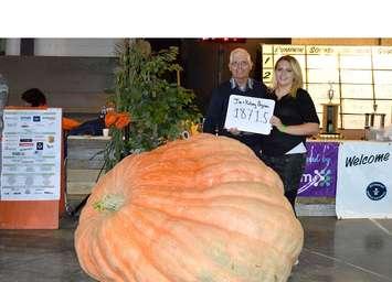 Jim and Kelsey Bryson of Ormstown, Quebec with their champion pumpkin at Port Elgin Pumpkinfest. It topped the scales at 1,871-lbs.
(Jordan MacKinon photo) 