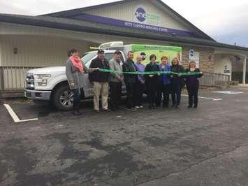 One Care staff, Ontario Trillium reps, and locals politicians pose in front of the Meals On Wheels truck in front of One Care in Clinton. They celebrated a ribbon cutting for the expansion of Meals On Wheels. Friday, November 25th, 2016 (Photo by Ryan Drury)