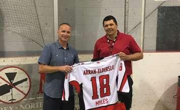 Washington Capitals head equipment manager and Chesley native Brock Myles, left, accepts a custom minor hockey jersey from Arran-Elderslie Minor Hockey President Jeff Irwin at Brock's day with the Stanley Cup at the Chesley Community Centre. August 3rd, 2018 (Photo by Ryan Drury)
