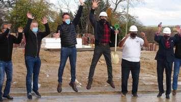 Jumping For Joy Over New Residential Development in Markdale.  Developer Larry Lecce (3rd from left).  Grey Highlands Mayor Paul McQueen (4th from left.). Photo by Kirk Scott. 