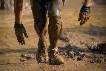 Mud race runner. © Can Stock Photo Inc. / Pavel1964