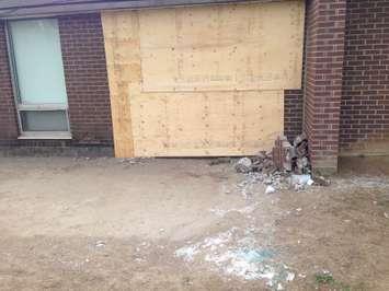Damage boarded up on the side of Scared Heart in Wingham after a car crashed into the school. (photo by Ryan Brandt)