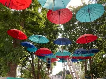Umbrellas hang in the back alleys of Clinton to colour up the space while downtown reconstruction work continued in July, 2021. (Submitted photo)