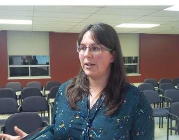 Dr. Erica Clark, Huron County Epidemiologist, speaking in Clinton Tuesday night. (photo by Bob Montgomery)