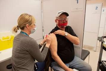  Rich Michaud, from Tillsonburg gets his COVID-19 vaccine at Gof Hall in Woodstock. March 15, 2021. (File photo supplied by Southwestern Public Health) 