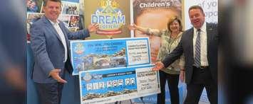 London Health Sciences Foundation President John MacFarlane, St. Joseph’s Health Care Foundation President Michelle Campbell, and Children’s Health Foundation President Scott Fortnum show off the winning cheques in the 2018 spring edition of the Dream Lottery, July 19, 2018. (Photo by Miranda Chant, Blackburn News)