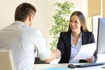 Successful job interview with boss and employee handshaking.  © Can Stock Photo / AntonioGuillem