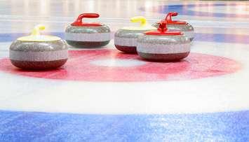 Curling stones. (Photo by © Can Stock Photo Inc. / Denikin) 