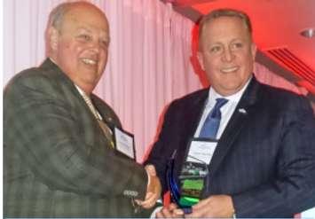 Steven Sparling (R) accepting the award on behalf of Grant Sparling from CPA Board Chair Guy Marchand.