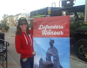 Angela Smith - Central Huron Community Improvement Co-ordinator with banner for unknown soldier (photo by Bob Montgomery) 