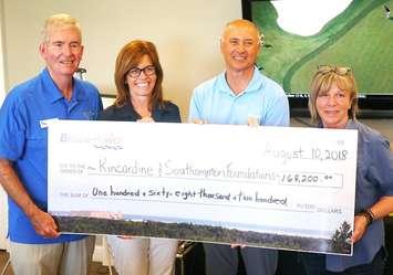 Jim Barbour, (left) Chair of Saugeen Memorial Hospital Foundation, and Becky Fair, President of the Kincardine and Community Health Care Foundation, will split between their organizations the $168,200 raised at the 17th annual Bruce Power Charity Golf Tournament.  Also in the photo is Mike Rencheck, Bruce Power’s President and CEO, and Peggy Zeppieri, Physician Recruiter. (photo submitted by Bruce Power) 