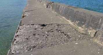 Erosion has washed sections of the concrete walkway into Lake Huron. (Photo by Jordan Mackinnon)