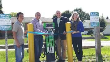 Francis Chua, Bruce Power’s Department Manager, Environment Management, left, and Emily Johnston, of Bruce Power’s Environment and Sustainability Department, right, joined Art Versteeg, Chair of the Maitland Valley Conservation Area (MVCA), and Deb Shewfelt, Vice Chair of the MVCA, in opening an electric vehicle charging station at the MVCA’s Wroxeter location.  (Photo by Craig Power © 2016)