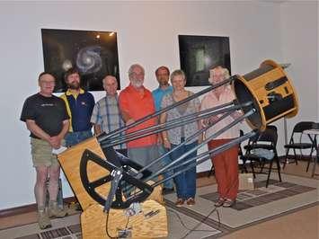 Bayside Astronomy Volunteers Doug Cunningham, Jeff Hatt, Lee Brown, Terrence Dickinson, Mike Warkenton, Christine Brown, Paula Cunningham with Terrence Dickinson's telescope.