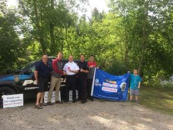 L-R: Brian Carr (South Saugeen Regional Coordinator) - Cody Jansma (Director of Business Development for the Special Olympics Ontario Law Enforcement Torch Run ) - Chief Robert Martin - Constable Cory Trainor - Brad Andrews and TJ Walton (Special Olympics Athletes) June 12th, 2019 (Photo provided by Constable Cory Trainor)