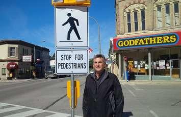 Huron County engineer Steve Lund at one of the new pedestrian crosswalks in Clinton (photo by Bob Montgomery)